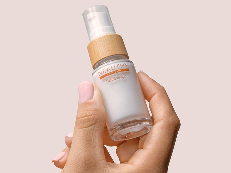 Hand Holding Cosmetics Bottle Hand Holding Cosmetics Bottle